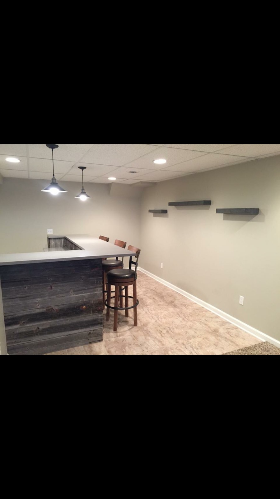 Finished basement with a built-in bar