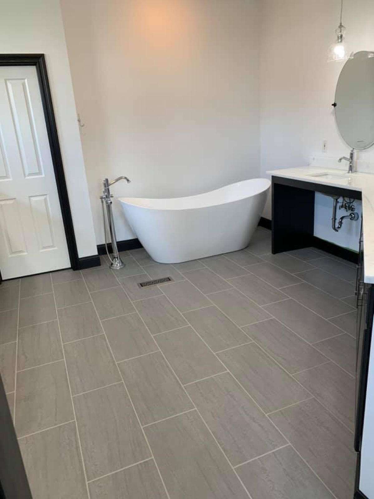Modern bathroom remodel with a freestanding tub