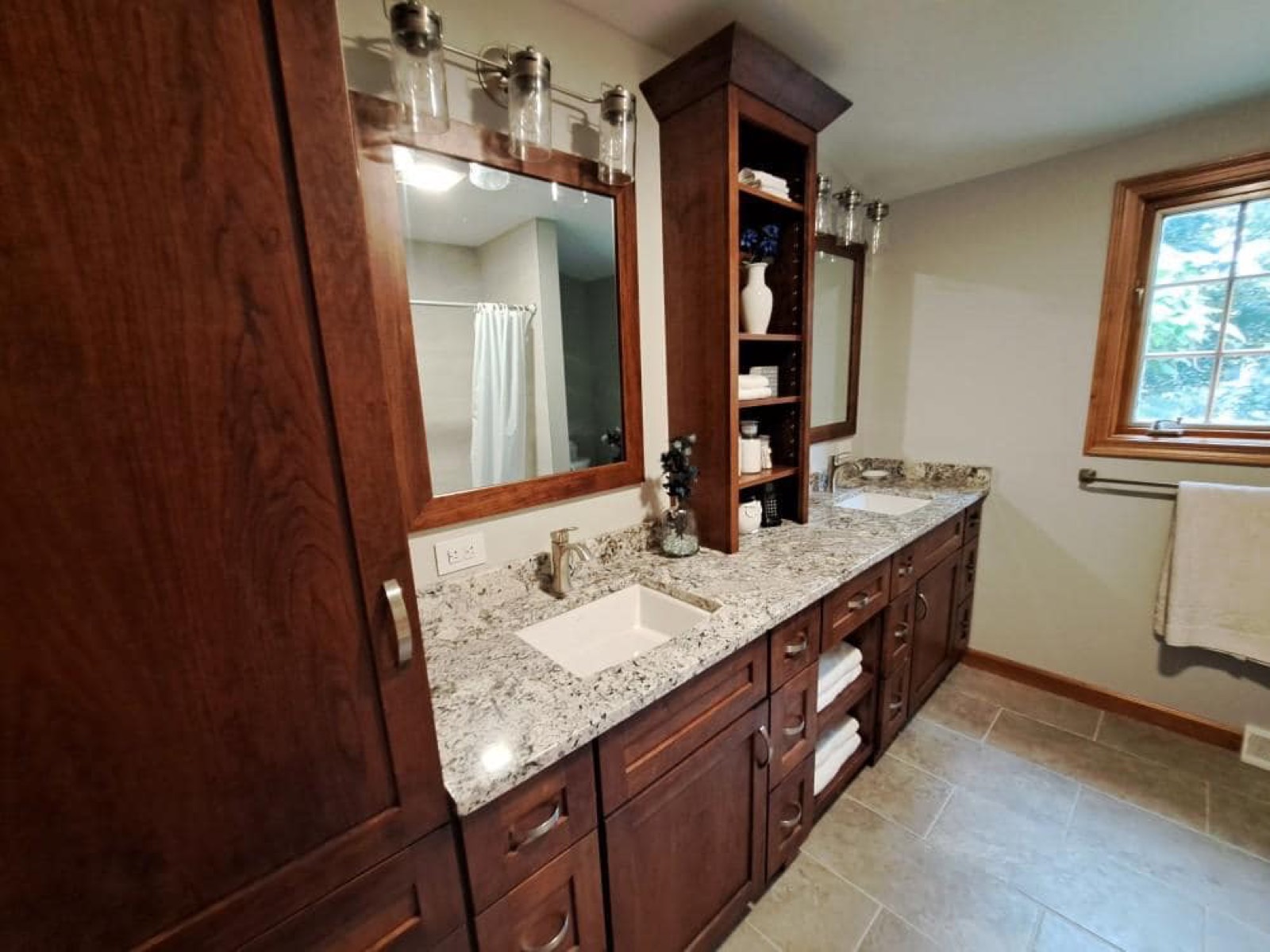 Bathroom remodel with a dark wood double vanity