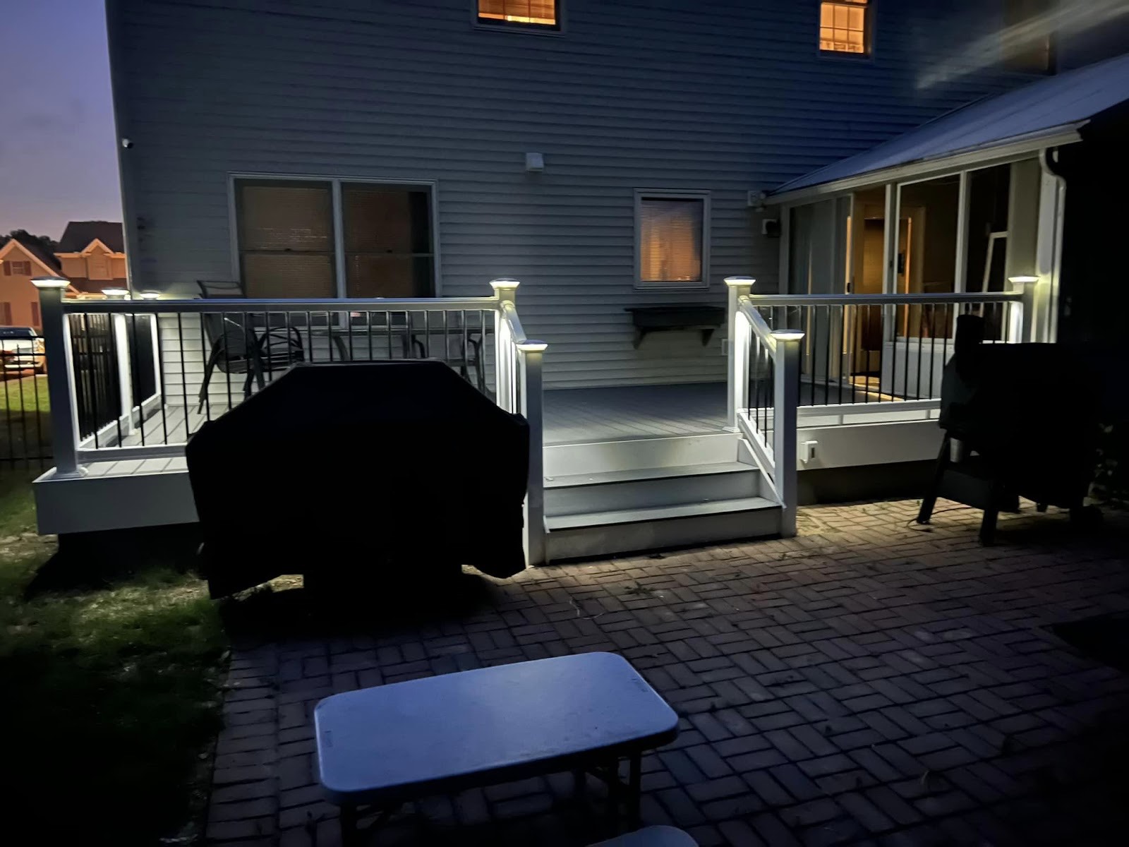 Rear deck and patio at dusk
