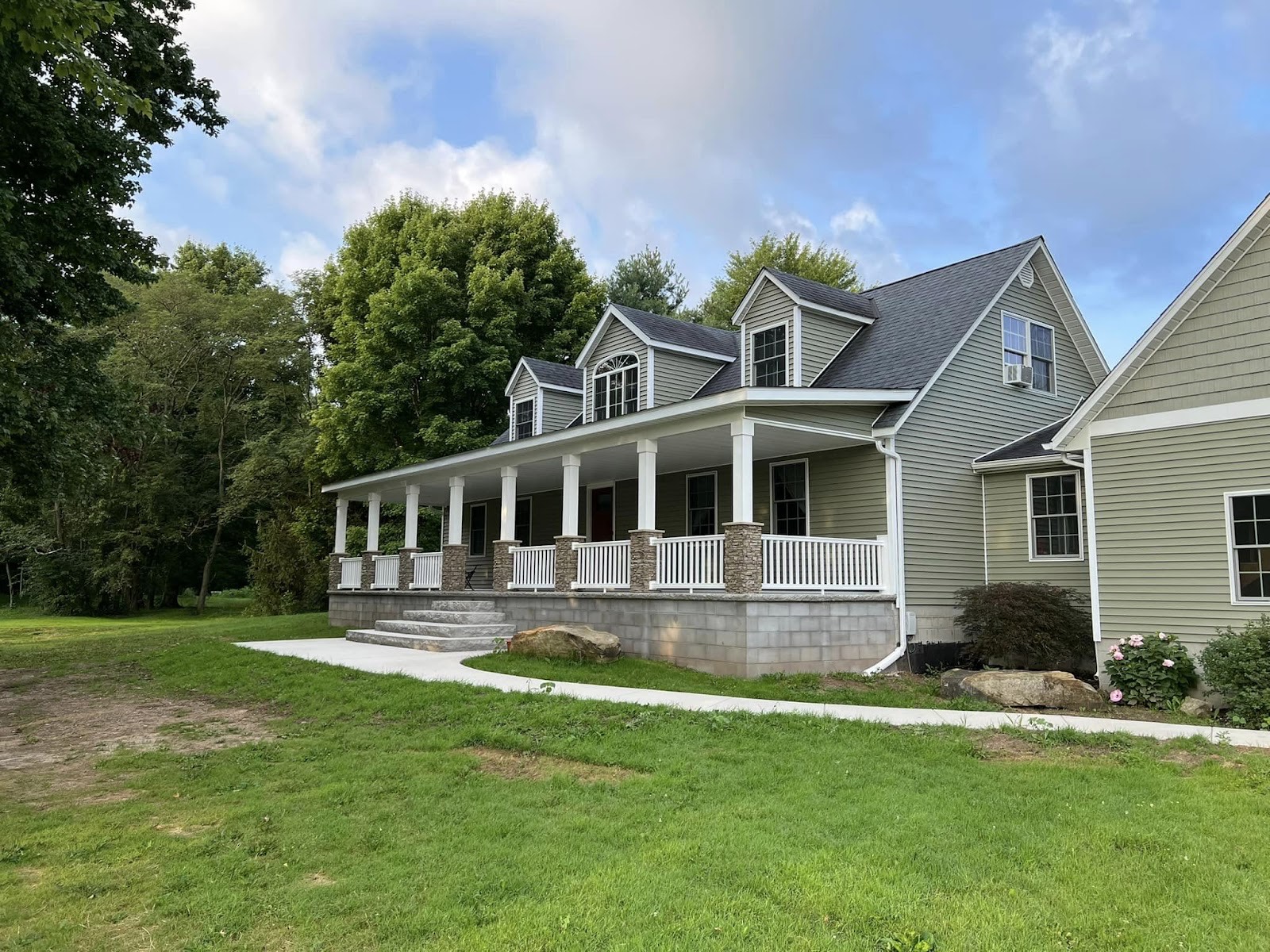 Home with a white-columned covered front porch